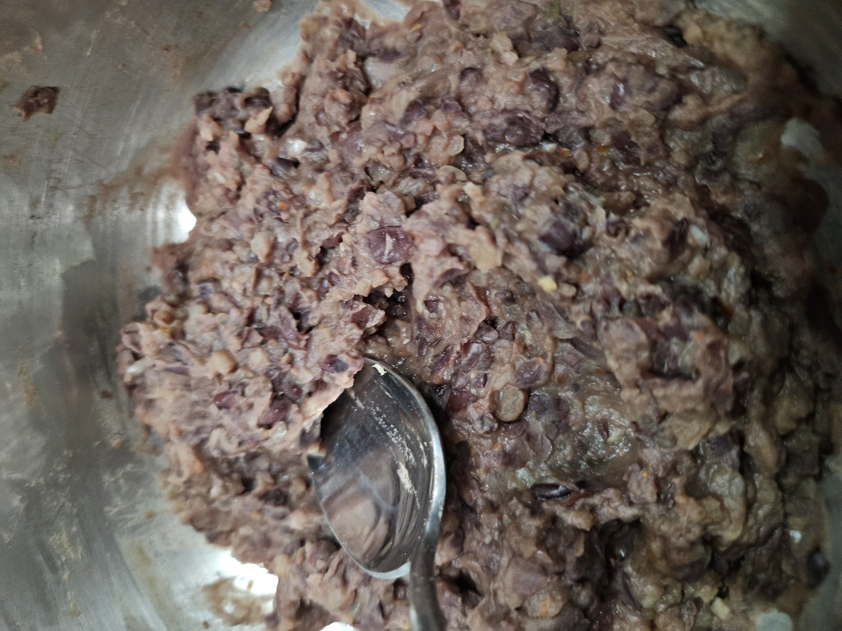 A picture of black bean paste in a pan